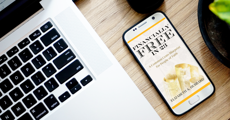 Financially Free in 23 e-book and computer keyboard